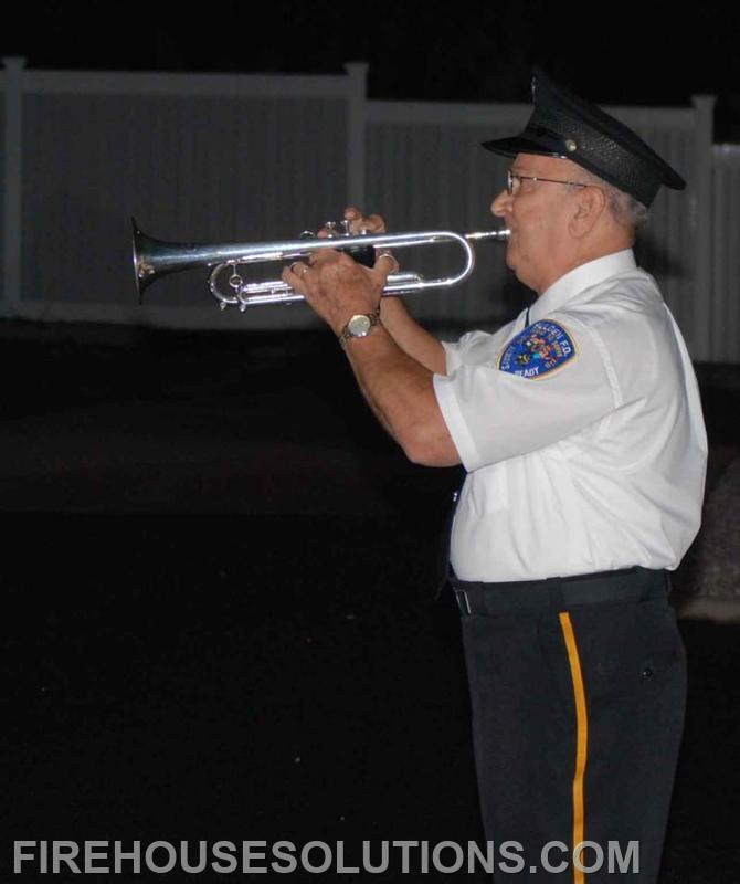Member of the Selden FD Band Plays Taps