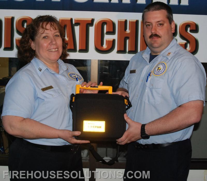 Capt. Eck and his Supervisor Patricia Dunn with the Lifesaving AED
